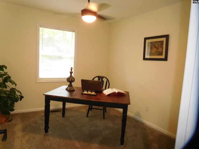 office featuring ceiling fan and dark colored carpet