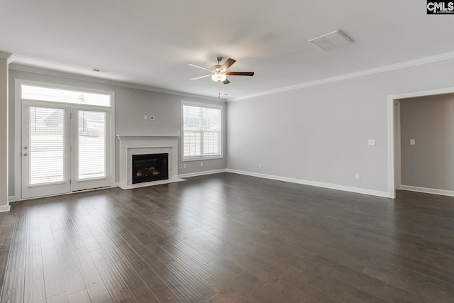 unfurnished living room with ceiling fan, dark hardwood / wood-style flooring, ornamental molding, and a fireplace