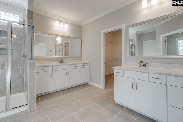 bathroom with tile patterned floors, an enclosed shower, vanity, and crown molding