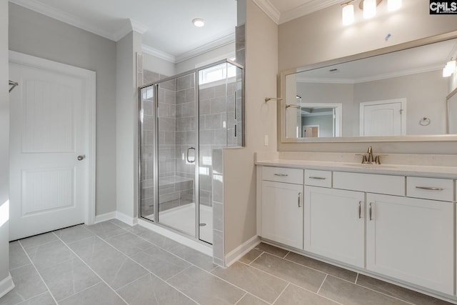 bathroom with tile patterned floors, walk in shower, crown molding, and vanity