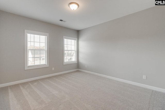 unfurnished room featuring carpet floors