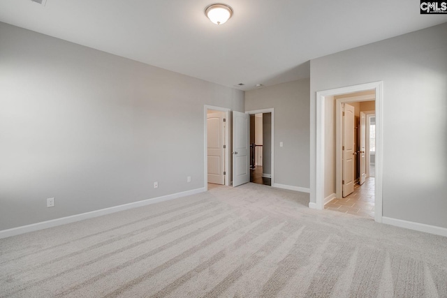 unfurnished bedroom featuring light colored carpet