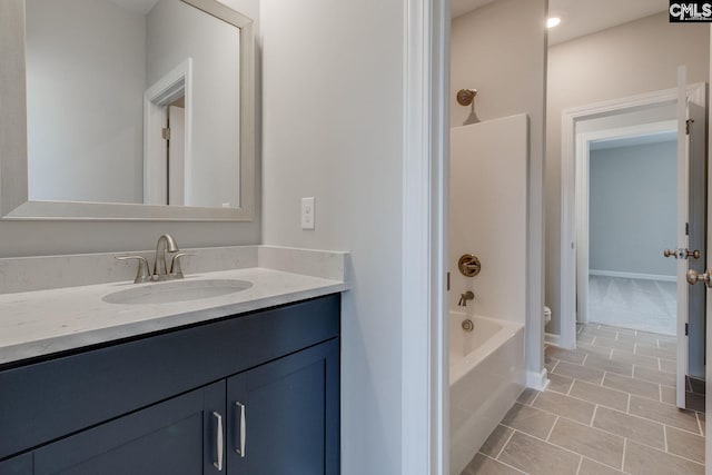 full bathroom with vanity, washtub / shower combination, tile patterned flooring, and toilet