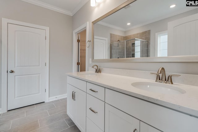 bathroom featuring vanity, walk in shower, crown molding, and tile patterned flooring