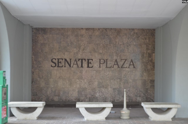 interior space with tile walls and toilet