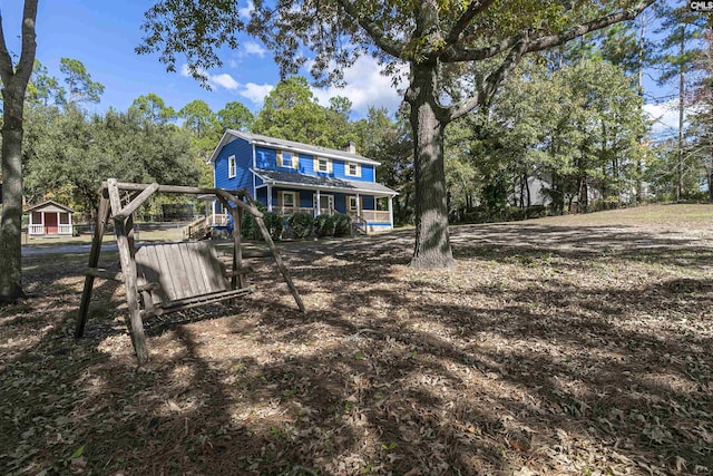 rear view of house with a porch