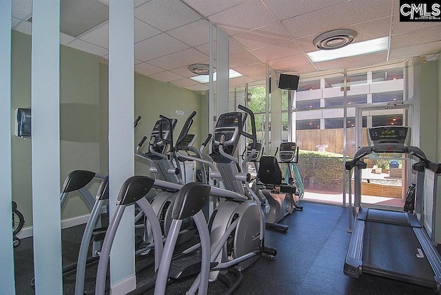 workout area featuring a drop ceiling