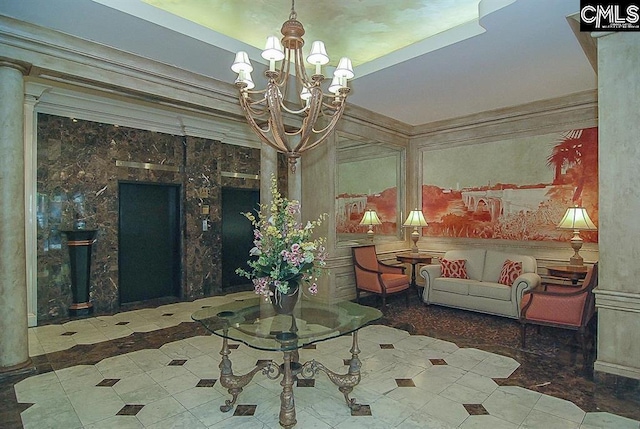 interior space with a chandelier and ornate columns