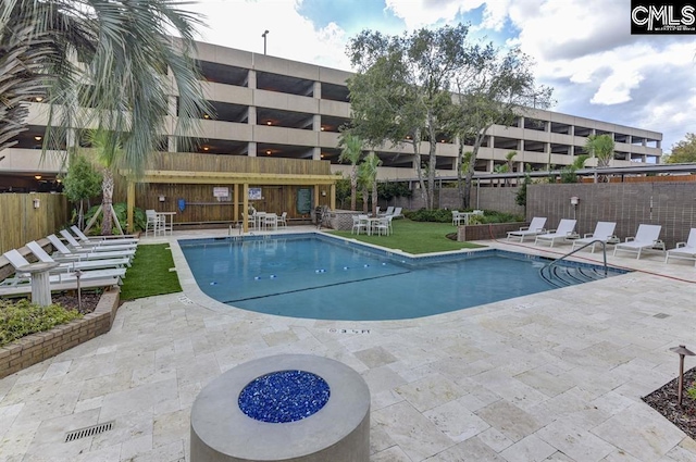 view of swimming pool featuring a patio