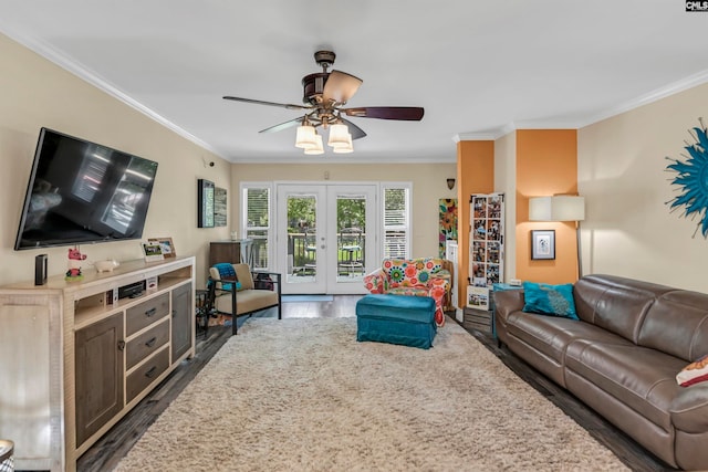 living room with french doors, dark hardwood / wood-style flooring, ornamental molding, and ceiling fan