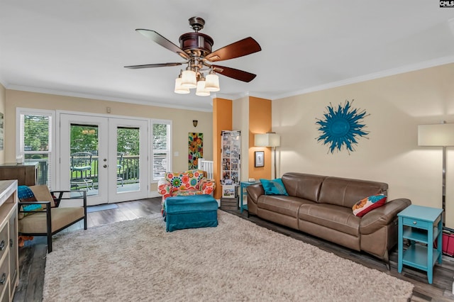 living room with ceiling fan, french doors, dark hardwood / wood-style flooring, and ornamental molding