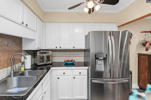 kitchen with stainless steel fridge, sink, ceiling fan, and backsplash