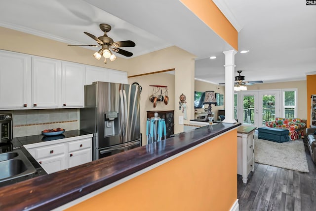 kitchen with stainless steel fridge with ice dispenser, crown molding, backsplash, dark wood-type flooring, and ceiling fan