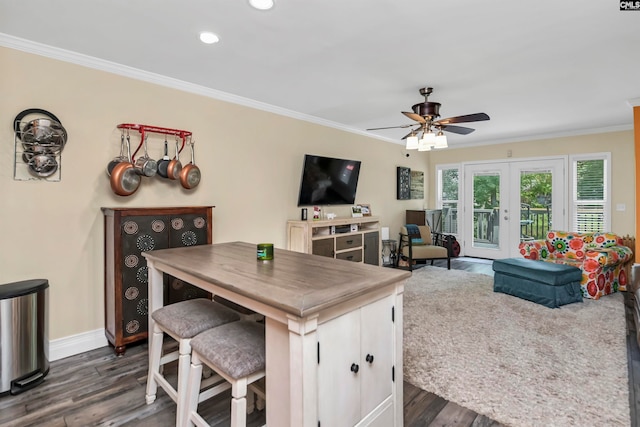 kitchen featuring crown molding, dark hardwood / wood-style floors, french doors, and ceiling fan