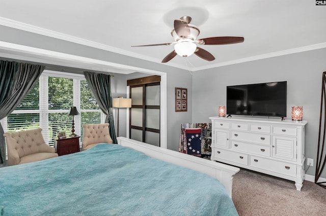 carpeted bedroom with crown molding and ceiling fan