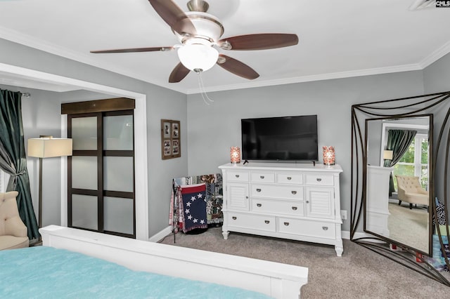 bedroom with ornamental molding, ceiling fan, and carpet flooring