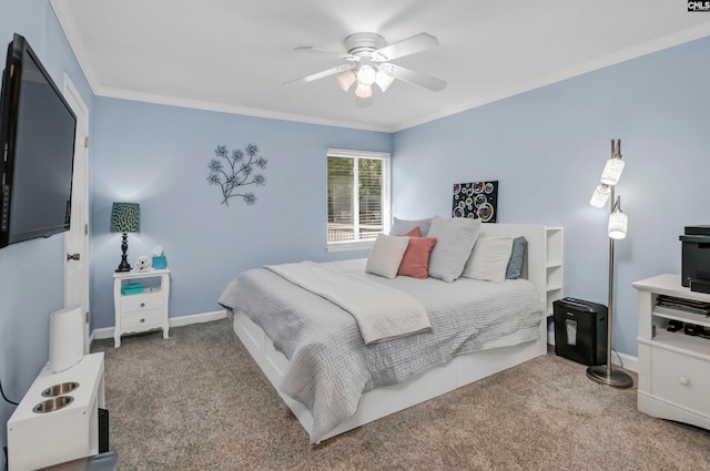 carpeted bedroom featuring ornamental molding and ceiling fan