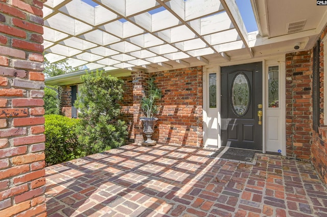 property entrance with brick siding