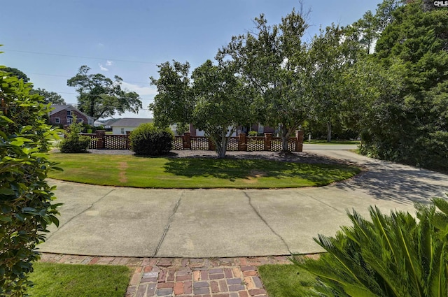 view of front of house featuring a front yard and fence