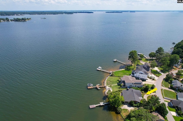 birds eye view of property featuring a water view and a residential view