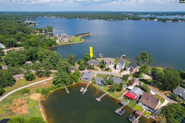 bird's eye view with a water view and a residential view