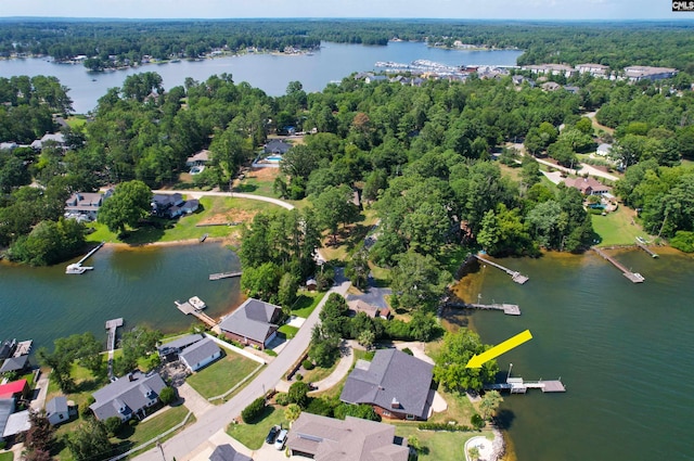 drone / aerial view featuring a water view and a residential view