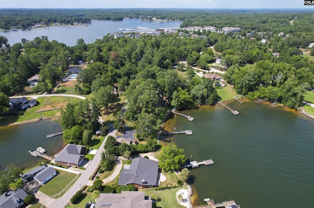 drone / aerial view featuring a water view and a residential view