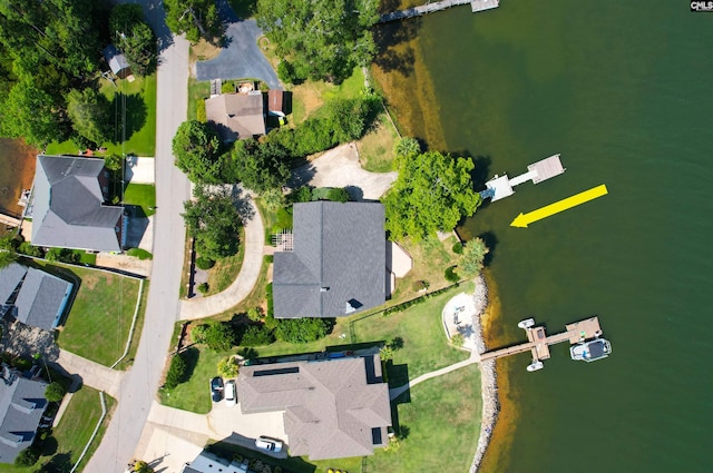 birds eye view of property featuring a water view and a residential view