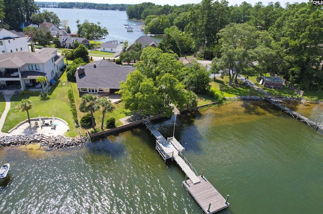 birds eye view of property featuring a water view and a residential view