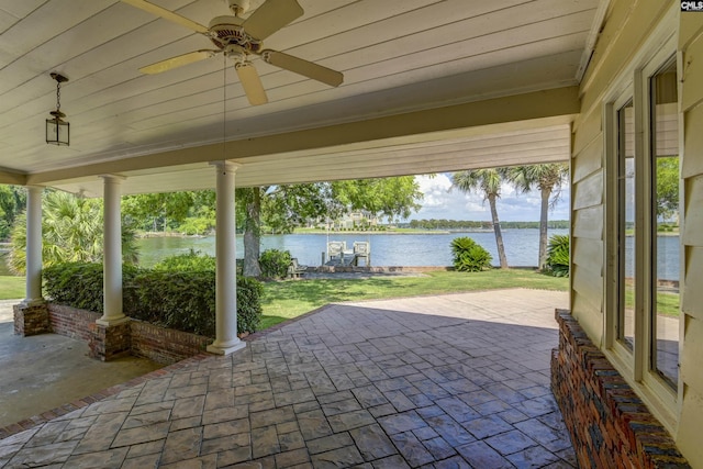 view of patio / terrace with a water view and ceiling fan