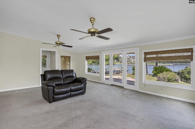 living area with carpet, crown molding, and baseboards