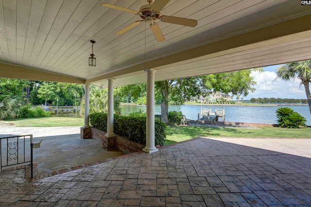 view of patio / terrace with a water view and ceiling fan