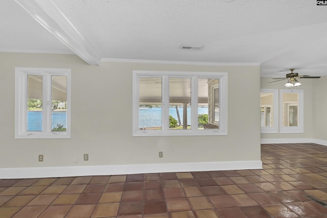 unfurnished room featuring baseboards, a textured ceiling, visible vents, and a wealth of natural light