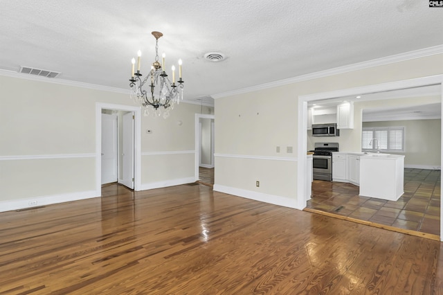 unfurnished living room with baseboards, visible vents, dark wood finished floors, and ornamental molding