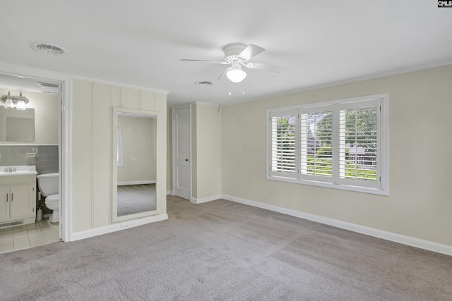 unfurnished bedroom featuring carpet and visible vents