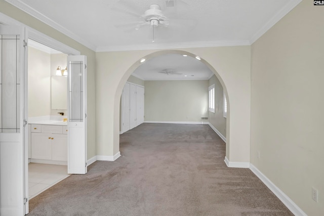 hall with carpet and ornamental molding