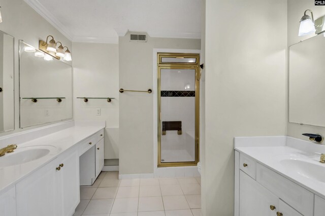 bathroom featuring tile patterned floors, toilet, vanity, and an enclosed shower