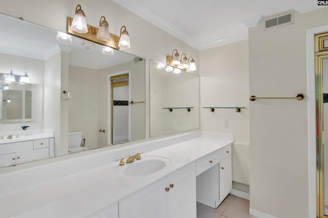 bathroom featuring ornamental molding, vanity, tile patterned floors, and toilet