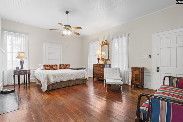 bedroom with dark wood-type flooring and ceiling fan