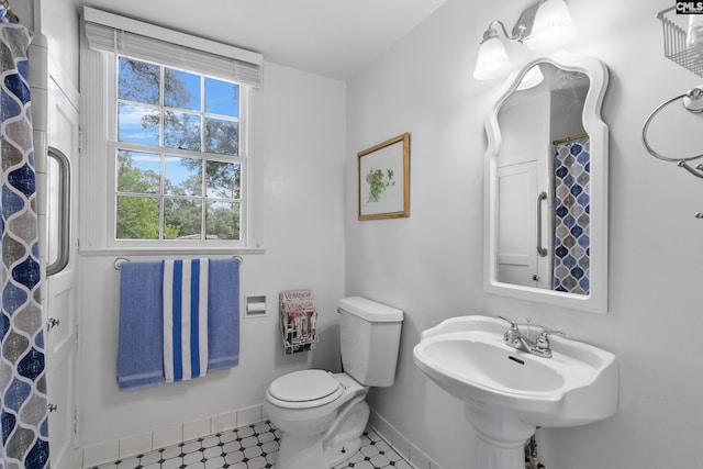 bathroom with toilet and sink