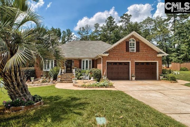 view of front of home with a garage and a front lawn