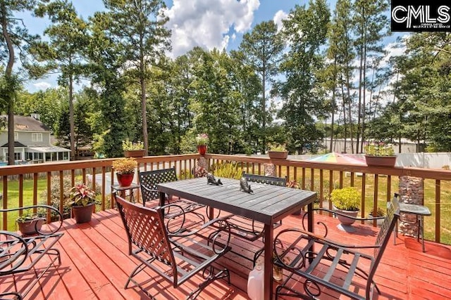 wooden deck with a yard