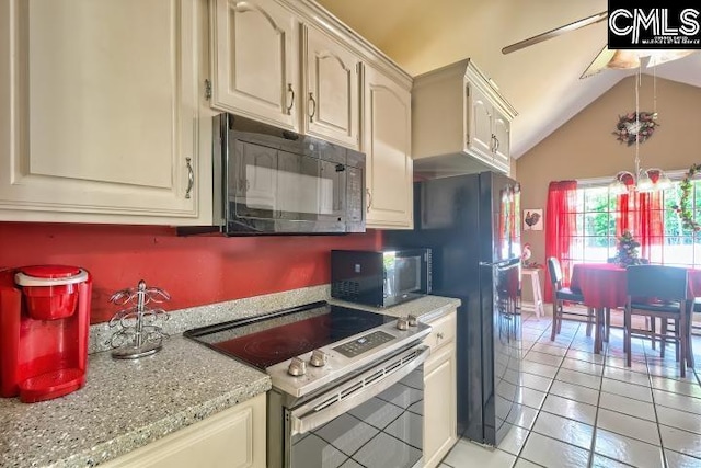 kitchen featuring stainless steel range with electric cooktop, light tile patterned floors, lofted ceiling, and ceiling fan