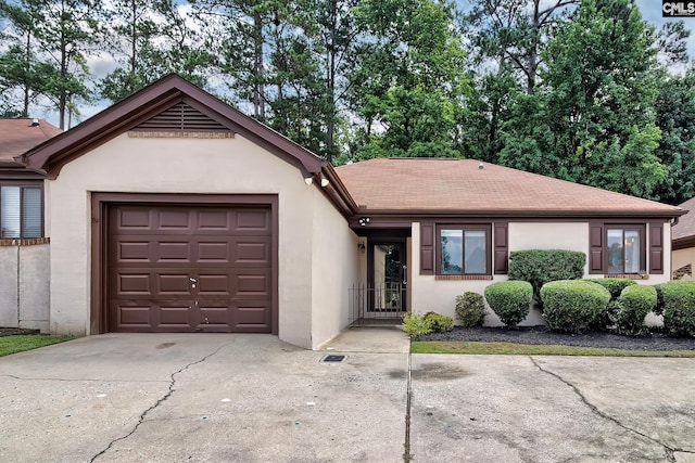 ranch-style home featuring a garage