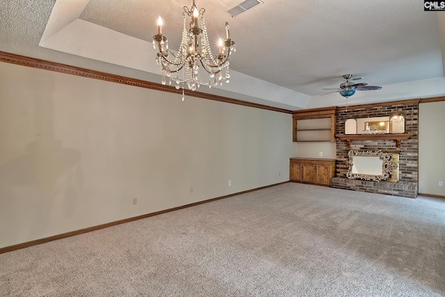 unfurnished living room with ceiling fan, carpet flooring, a fireplace, a textured ceiling, and a raised ceiling