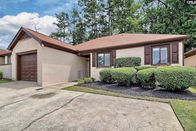 single story home featuring a garage