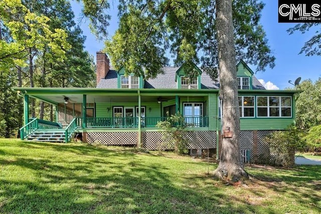 view of front of home featuring a front yard, ceiling fan, and a porch