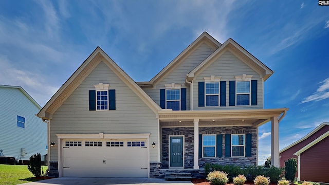 craftsman house with a garage and cooling unit