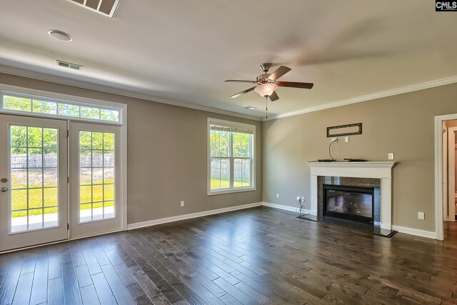 unfurnished living room with dark wood-type flooring and a wealth of natural light