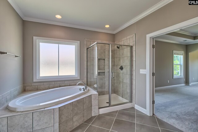 bathroom with crown molding, tile patterned floors, and separate shower and tub